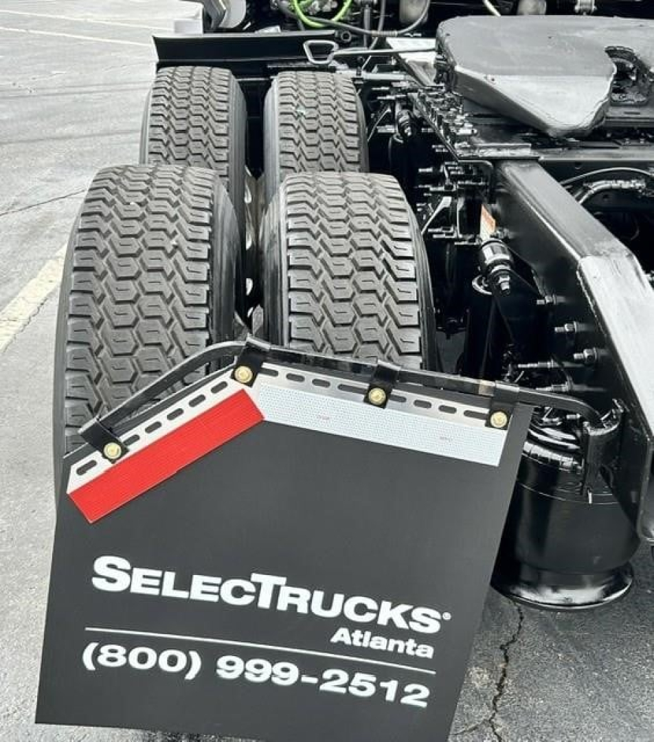 Freightliner Cascadia tractor rear view showing dual rear axles and trailer hitch plate with SelectTrucks Atlanta branding.