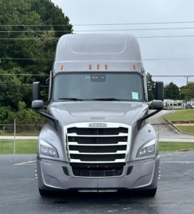 Tractor cab front view of a 2022 Freightliner Cascadia 126. Chrome grille, headlights, bumper, and high-roof sleeper with aerodynamic contours. License plate area empty.