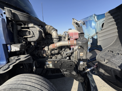 Kenworth T680 engine bay showing exposed intake hoses and engine components