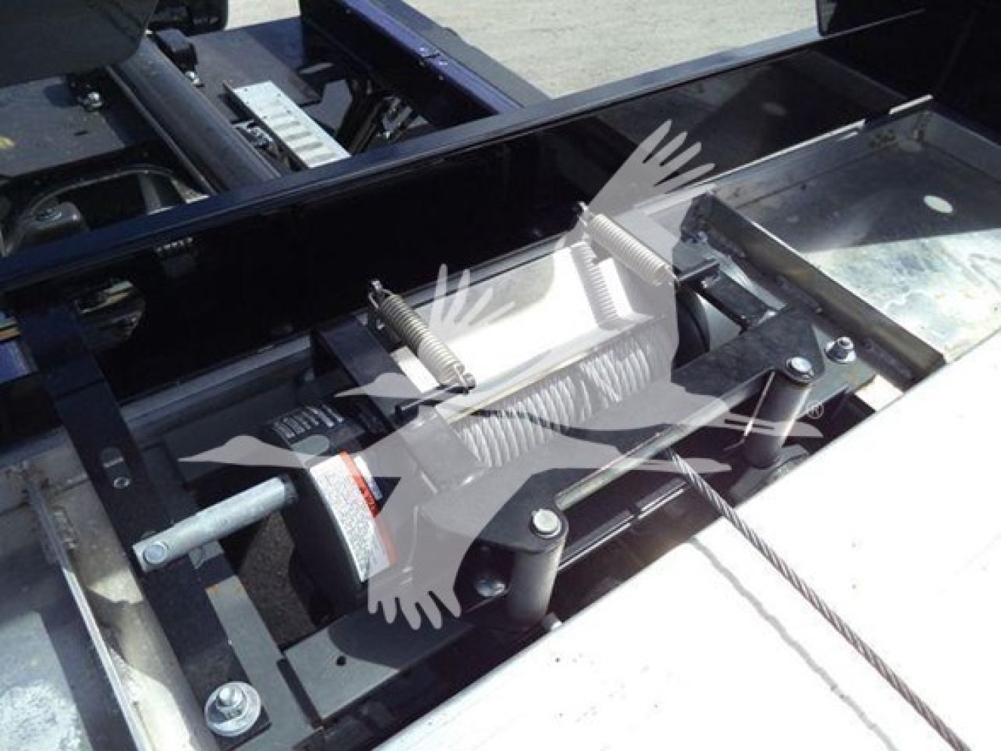 Industrial truck components: hydraulic cylinder with spring-loaded clamps and metal framework, bolts, and mounting hardware visible.