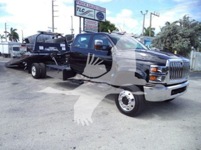 Truck in service pickup cab with a flatbed rollback wrecker truck, black color, large chrome grille, dual rear wheels, VIN 1HTKTSWK9PH419807 visible on stock sheet.