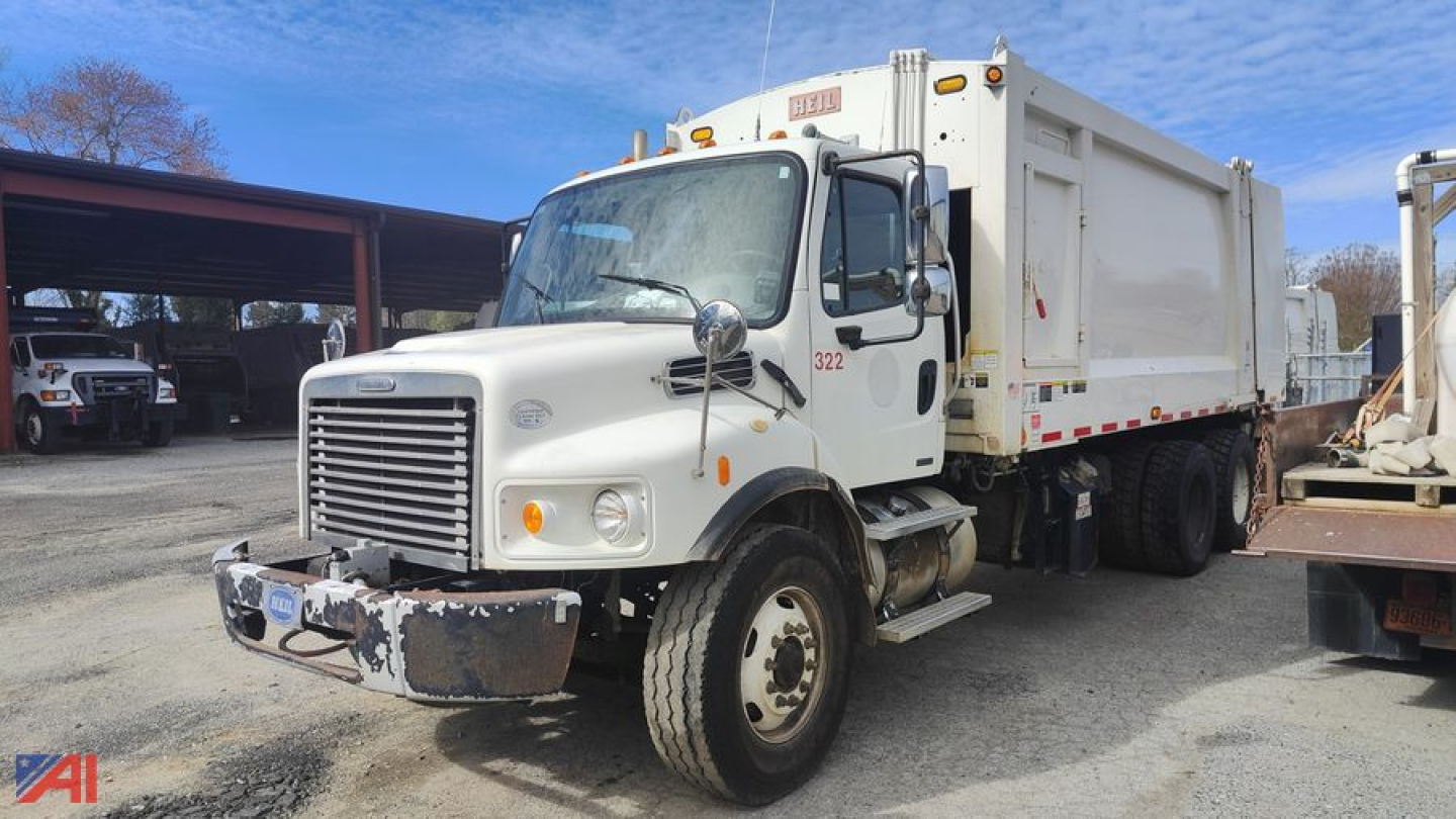Equipment: Freightliner M2 106 garbage truck in service view showing side and front with hopper and body panels.
