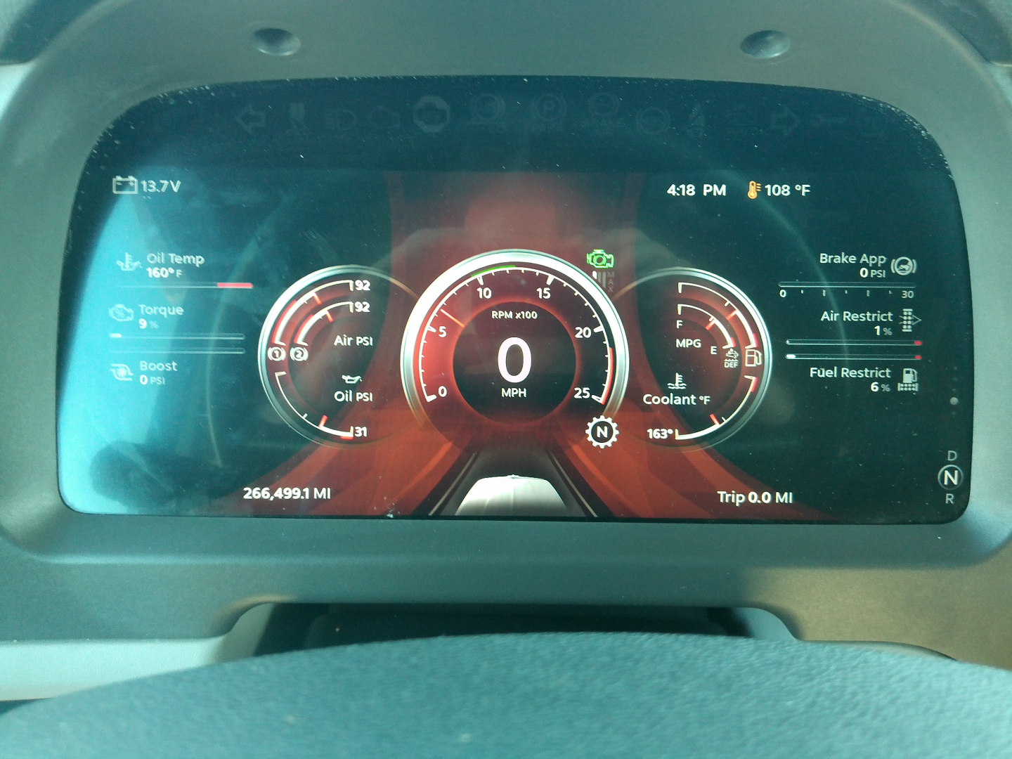 Peterbilt 579 digital instrument cluster display showing various gauges and readouts, including speedometer, fuel, oil temperature, and engine metrics.