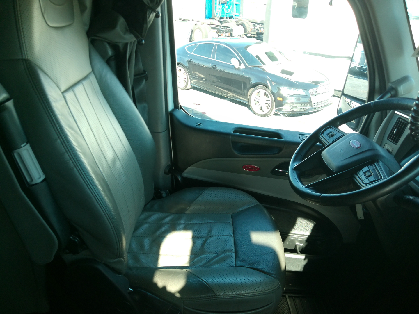 Peterbilt 579 truck interior driver seat and steering wheel view