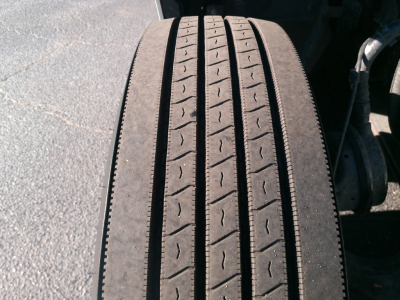 Truck wheel/tire tread close-up view from a Peterbilt 579 tractor with visible tread pattern and sidewall.