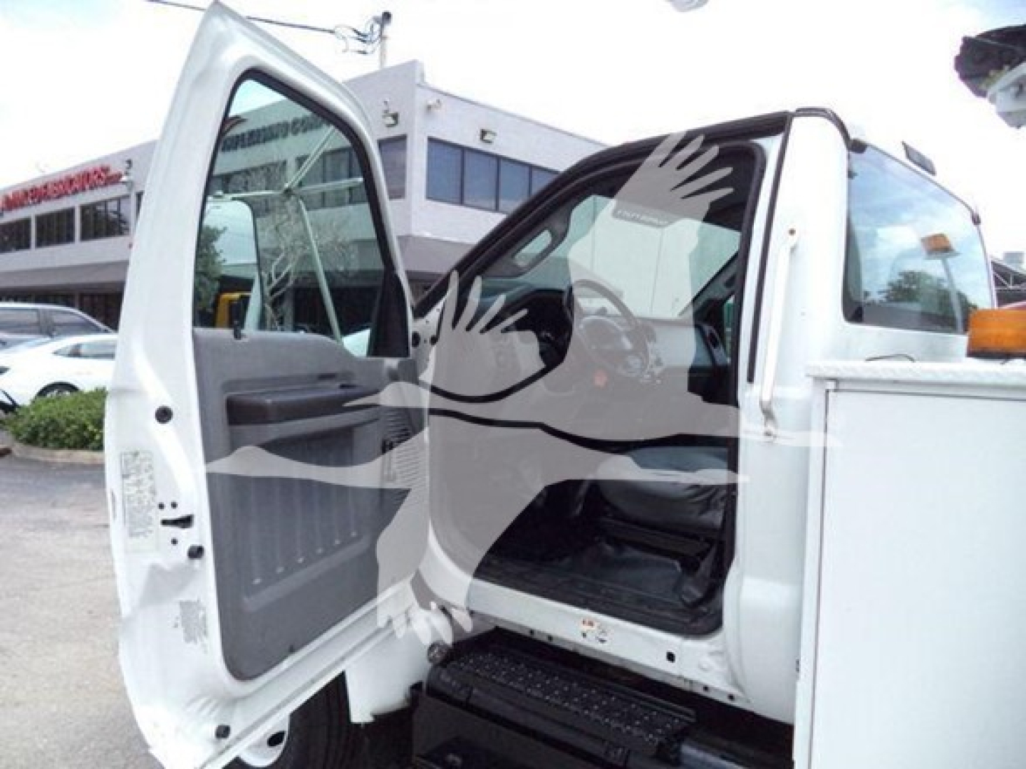 Versalift VST40i crane cab area with front passenger door open showing interior and steps.