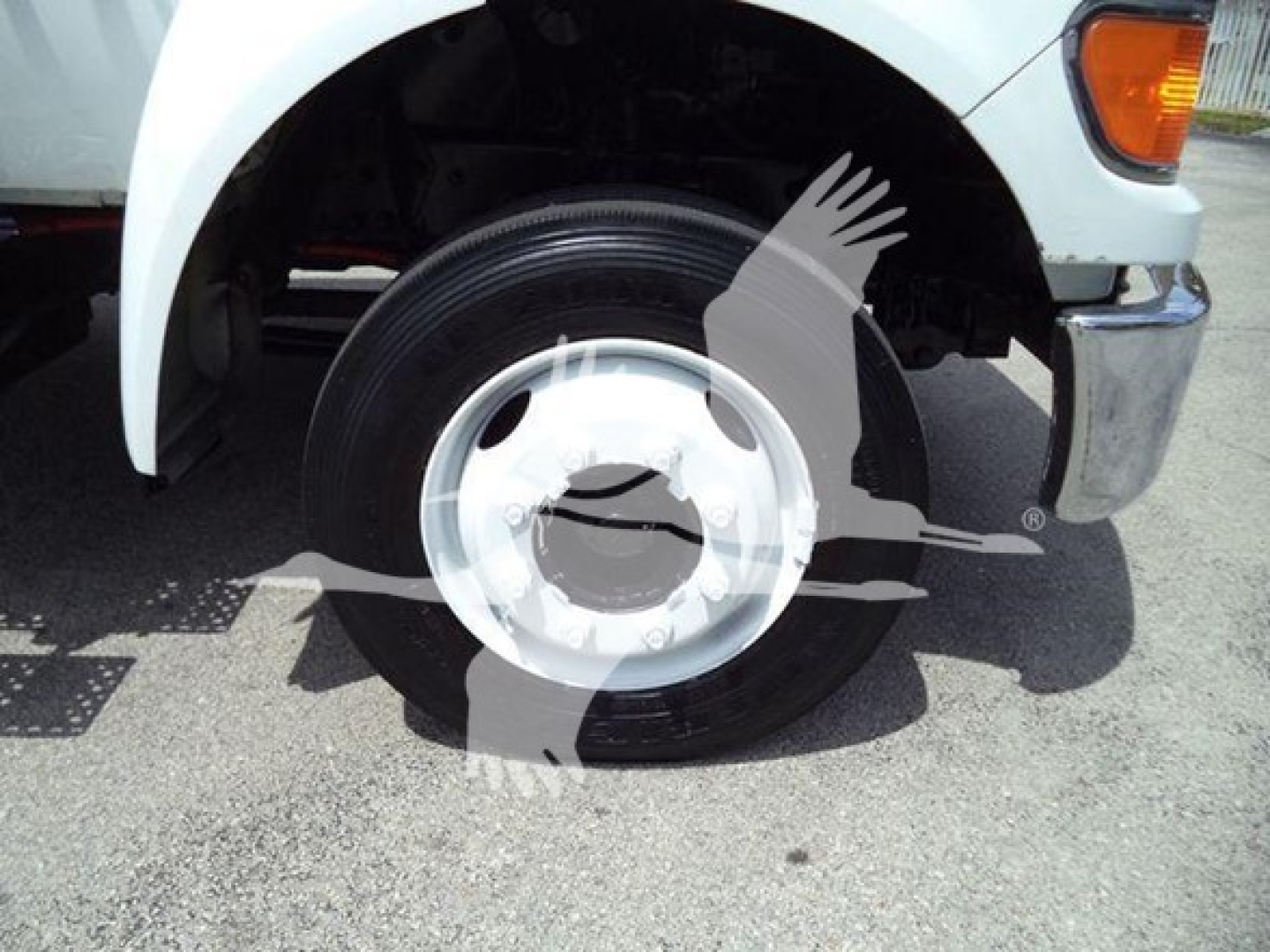 Versalift VT40i crane truck front wheel and fender showing hubcap and tire detail