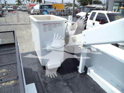 Versalift VST40i crane bucket and arm in a compact side view showing a white hydraulic platform and support structure.