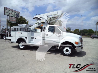 Versalift VST40i crane truck in service mode with boom elevated, white utility truck with compartments, VIN KW130024 sticker not visible, T91592 stock number visible in listing.