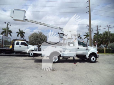 Versalift VST40i crane mounted on a utility truck with extended boom and bucket in serviceable condition.
