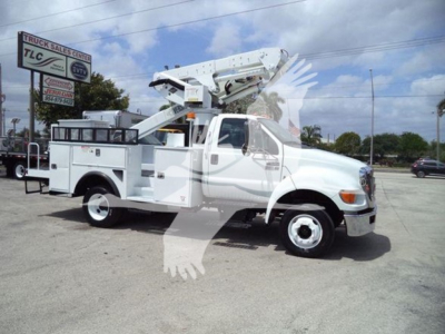 Versalift VST40i bucket truck mounted crane on white pickup chassis, side view showing crane boom extended over cab.