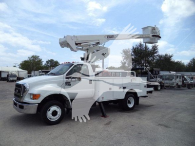 Versalift VST40i bucket truck in-service view showing hydraulic boom and bucket at full extension on a white truck chassis.
