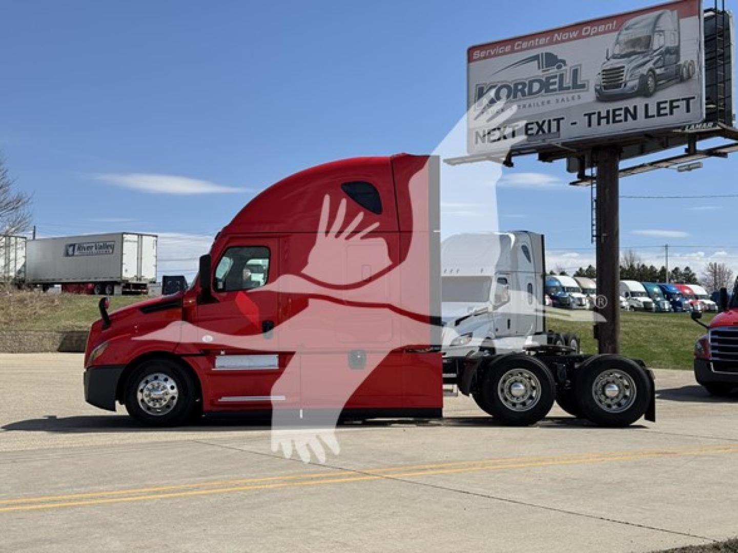 Truck: 2023 Freightliner Cascadia 126 conventional sleeper, red with white trailer, visible stock number 2603018 and signboard in background.