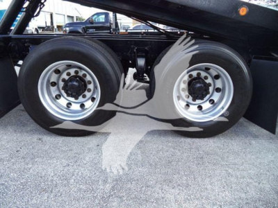 Freightliner M2 106 side view showing dual rear wheels and undercarriage components.