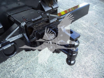 Truck hitch and towing apparatus showing ball hitch and safety chain mount with mounting hardware.