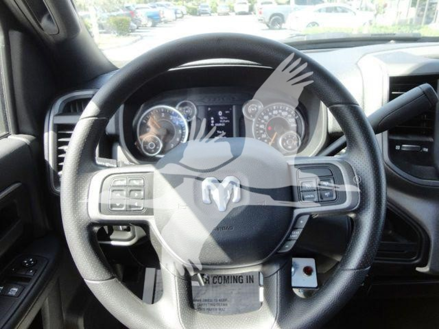 Ram 5500 interior steering wheel and dashboard, with instrument cluster visible through steering wheel.