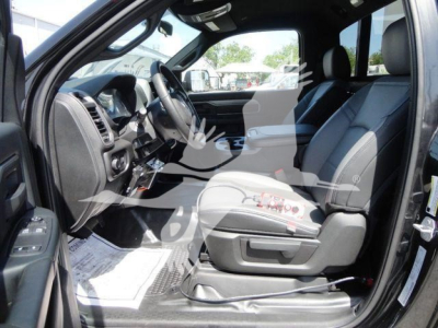 Ram 5500 HD truck interior showing front seats, steering wheel, center console, and dashboard in a new unit.