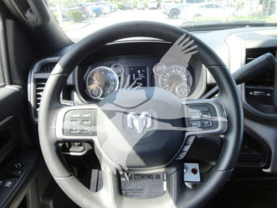 Ram 5500 interior steering wheel and dashboard, with instrument cluster visible through steering wheel.