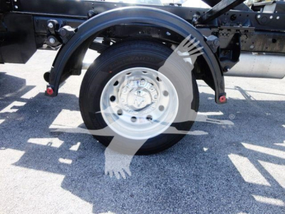  Ram 5500 chassis showing rear wheel, hub cap, and suspension components | no fluid labels visible