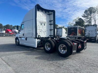 Freightliner Cascadia 126 tractor cab and chassis side/rear view with sleeper, showing rear wheels and fifth wheel area.