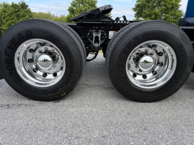 Dual rear truck wheels and suspension on a Peterbilt 579 in-service tag