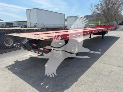 2018 Landoll 343B traveling axle trailer showing red flatbed and wheel hubs.