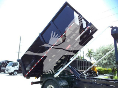 Dump truck bed raised with hydraulic cylinders in a roll-off configuration; label text not readable; MV International likely; VIN 3HAEUMML6LL880582; stock T80582.