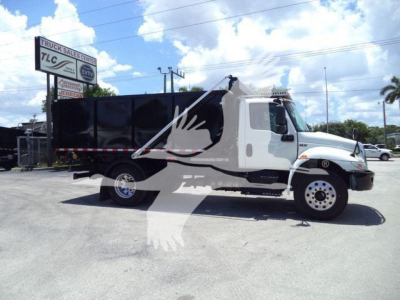 Truck profile showing 2020 International MV rolloff truck with black dump body and white cab, VIN 3HAEUMML6LL880582, stock T80582.