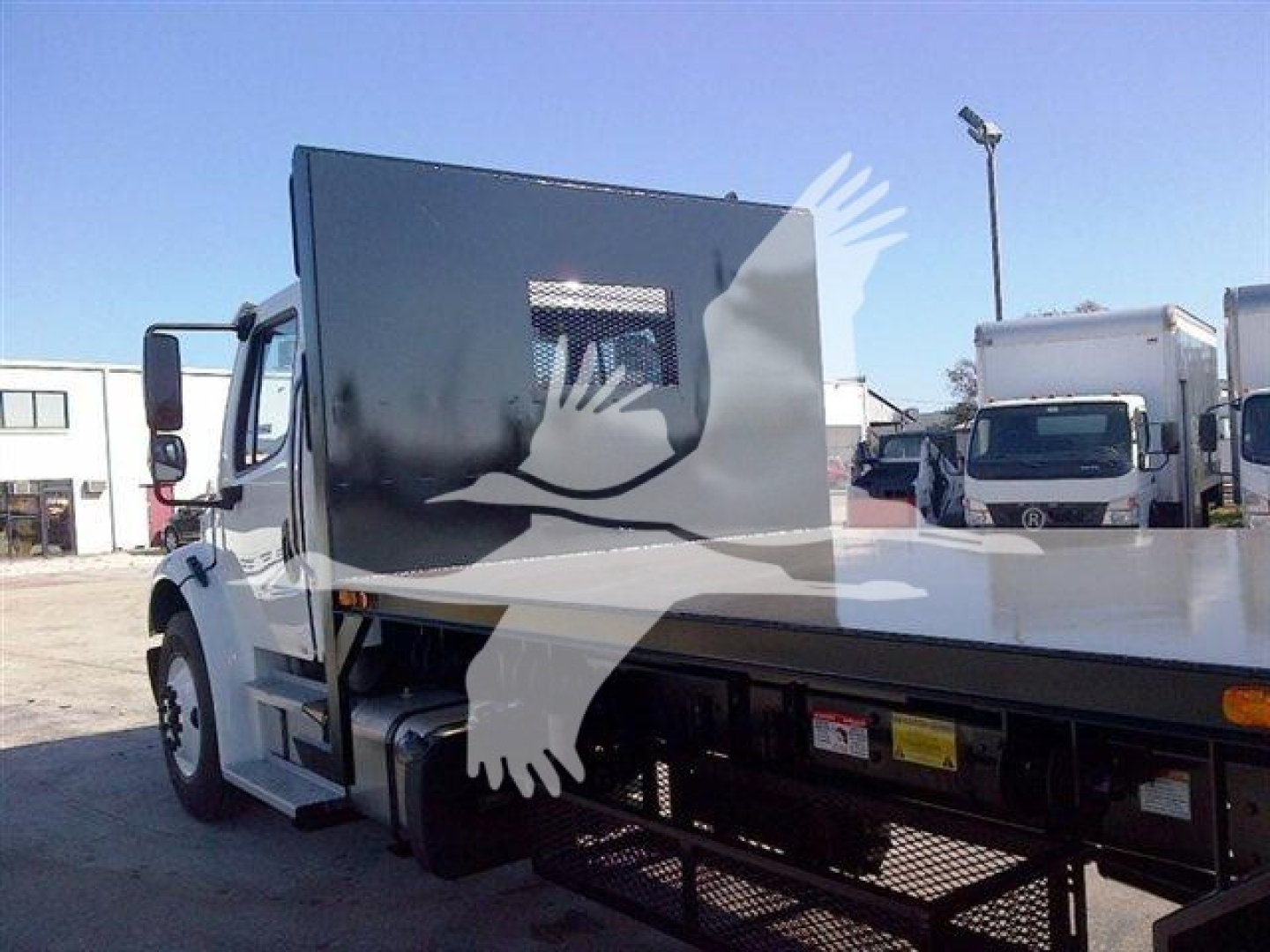 Flatbed truck from 2026 Advanced Fabricators 20 ft showing side view with flatbed and cab, stock number 20FB96, category flatbed, new truck.