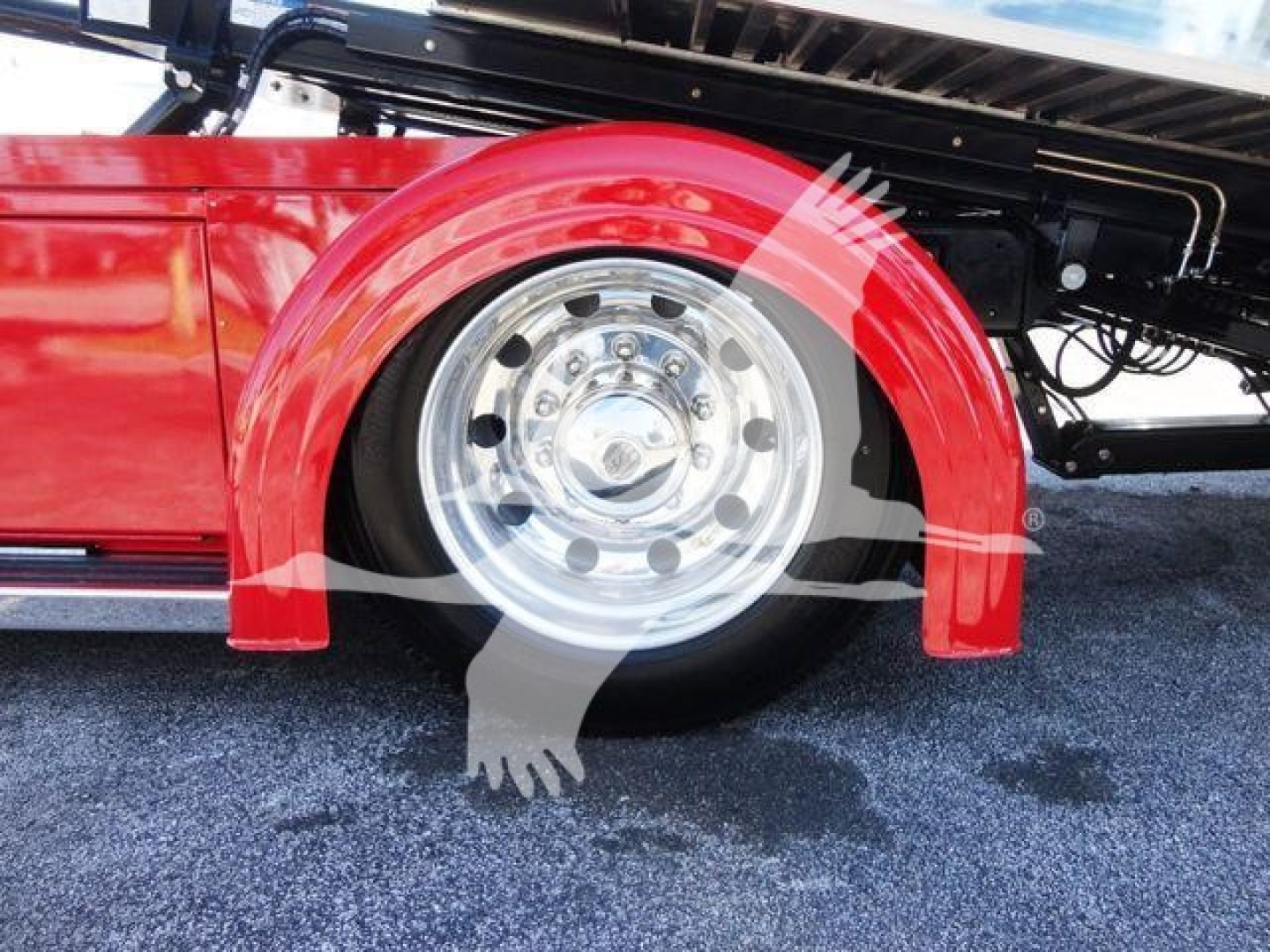 Peterbilt 337 rollback truck wheel and red fender shown in side view