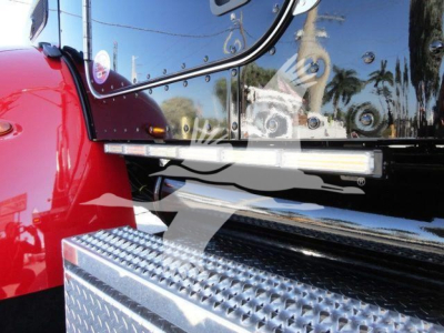 Truck cab side and step panel with diamond plate; reflection of surroundings in chrome mirror and black surface.
