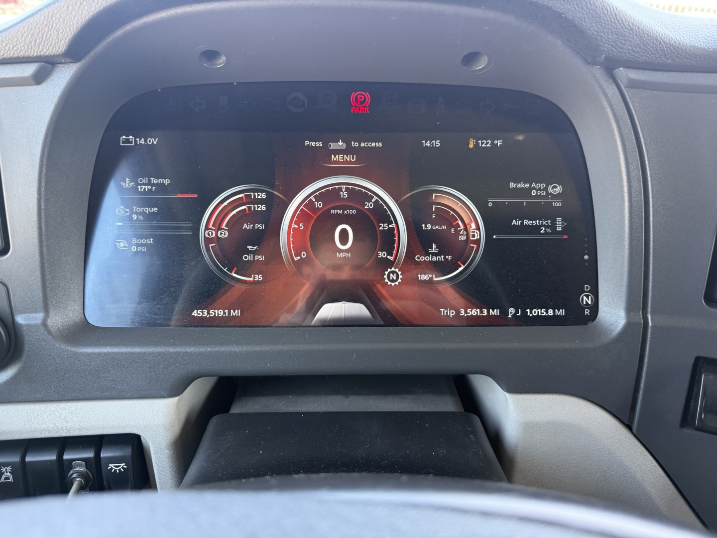 Peterbilt 579 dashboard display showing digital gauges and center odometer at 0 mph, with instrument cluster graphics and warning icons visible.