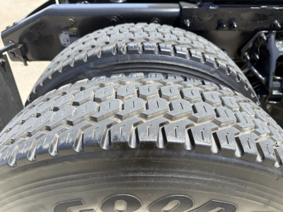 Peterbilt 579 wheel set with dual rear tires and tread detail visible, chassis frame nearby.
