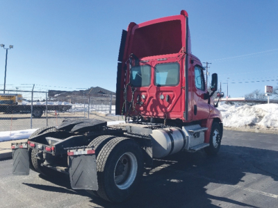 Truck cab rear view showing Freightliner Cascadia125 chassis and rear tires