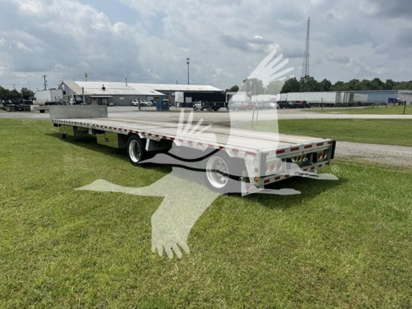 Trailer showing flatbed drop deck with dual rear axles and rear safety lights. 2019 Reitnouer Dropmiser with Ras, VIN 1RND48A24KR045071, stock 7621, used.