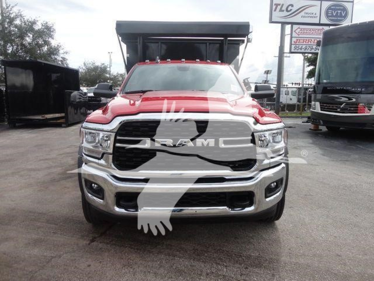Front view of a red 2024 Ram 5500 SLT pickup truck with large grille and bumper, showing RAM badge and headlights.
