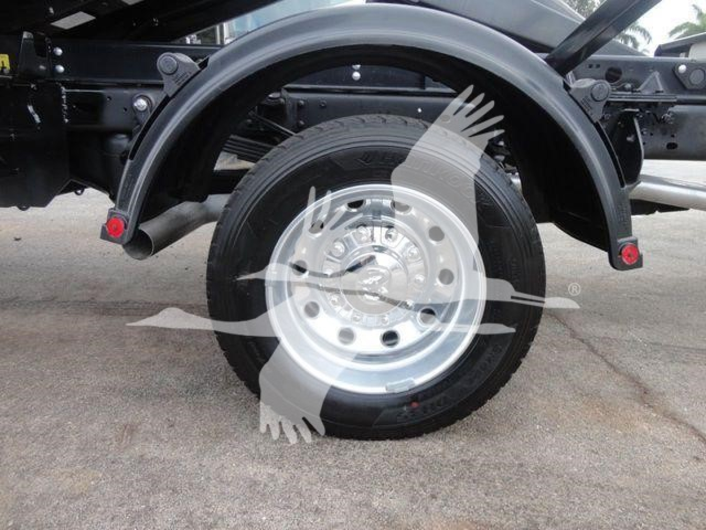 Ram 5500 truck rear wheel and fender view showing wheel, tire, and suspension components.