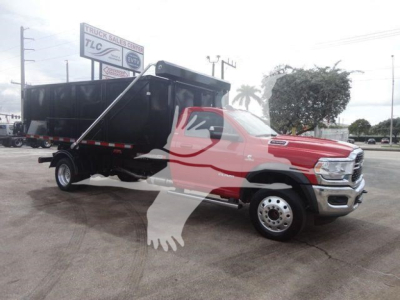 Ram 5500 dump body Hooklift truck in red and black, side view, stock number DSL550014SNGFM, new with cab and chassis