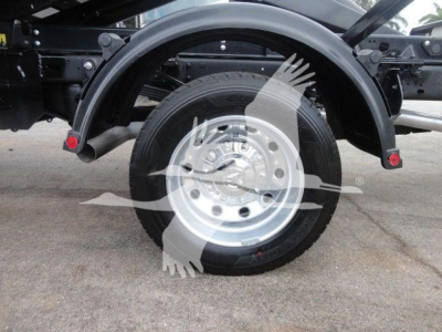 Ram 5500 truck rear wheel and fender view showing wheel, tire, and suspension components.