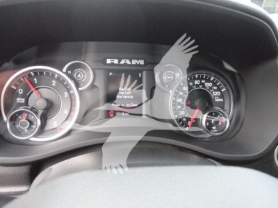 Ram dashboard displaying gauges and central info screen in a 2024 Ram 5500 SLT, with tachometer, speedometer, and various indicators.