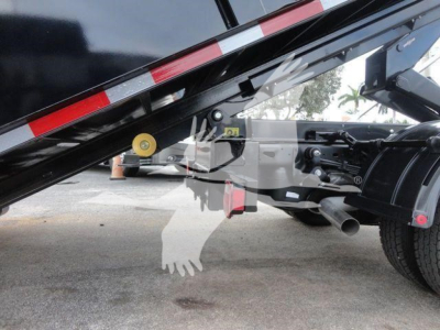 Ram 5500 SLT hooklift truck chassis showing hydraulic mechanism and frame undercarriage components