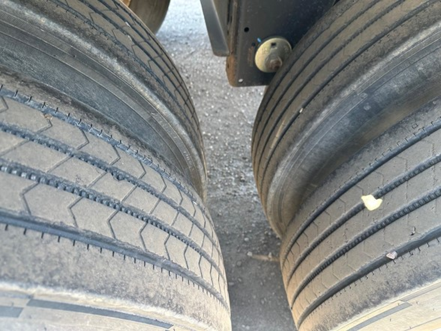 Timpte hopper trailer dual rear tires showing tread and sidewall with light road grime.