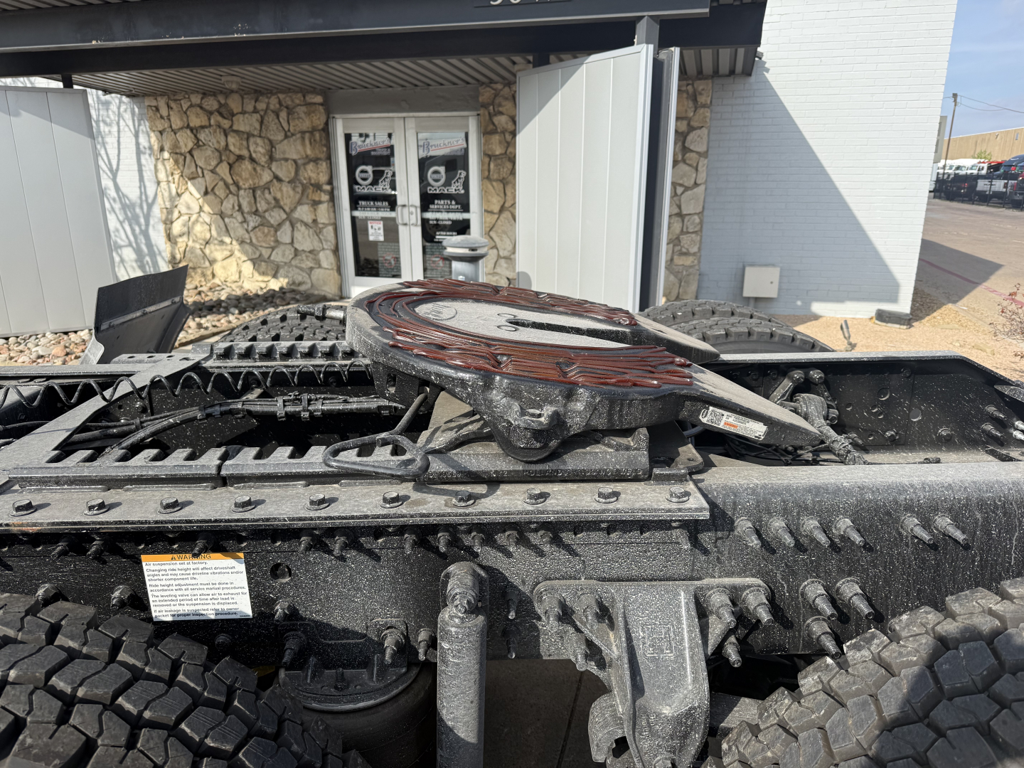 Volvo VHD64FT300 truck chassis view showing fifth wheel and rear frame with tires.