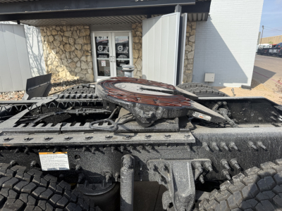 Volvo VHD64FT300 truck chassis view showing fifth wheel and rear frame with tires.