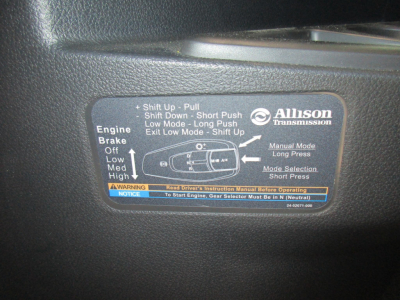 Allison transmission label with operating instructions and shift pattern located on vehicle dash panel.