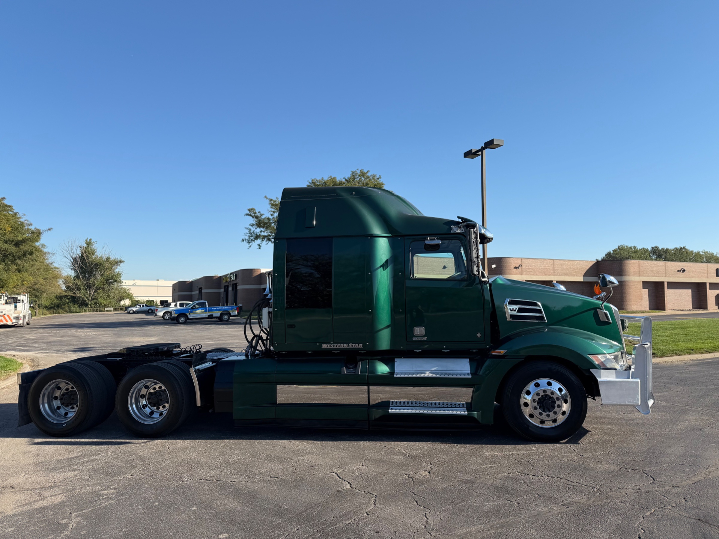 Semi truck 2017 Western Star 5700XE side view with green cab and sleeper