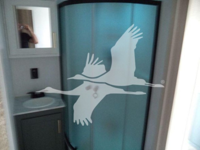 Trailer interior door with blue panel and a white seagull graphic.