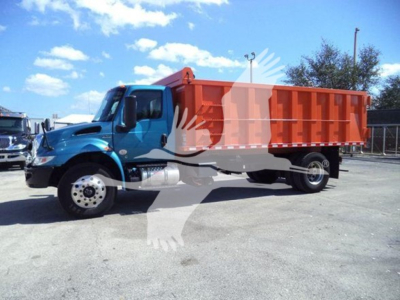 Dump truck in blue cab with orange dump bed, side view, no additional legible text visible on truck or bed.