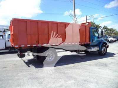 Dump truck with orange dump bed and blue cab, side view showing the cargo bed and wheel.