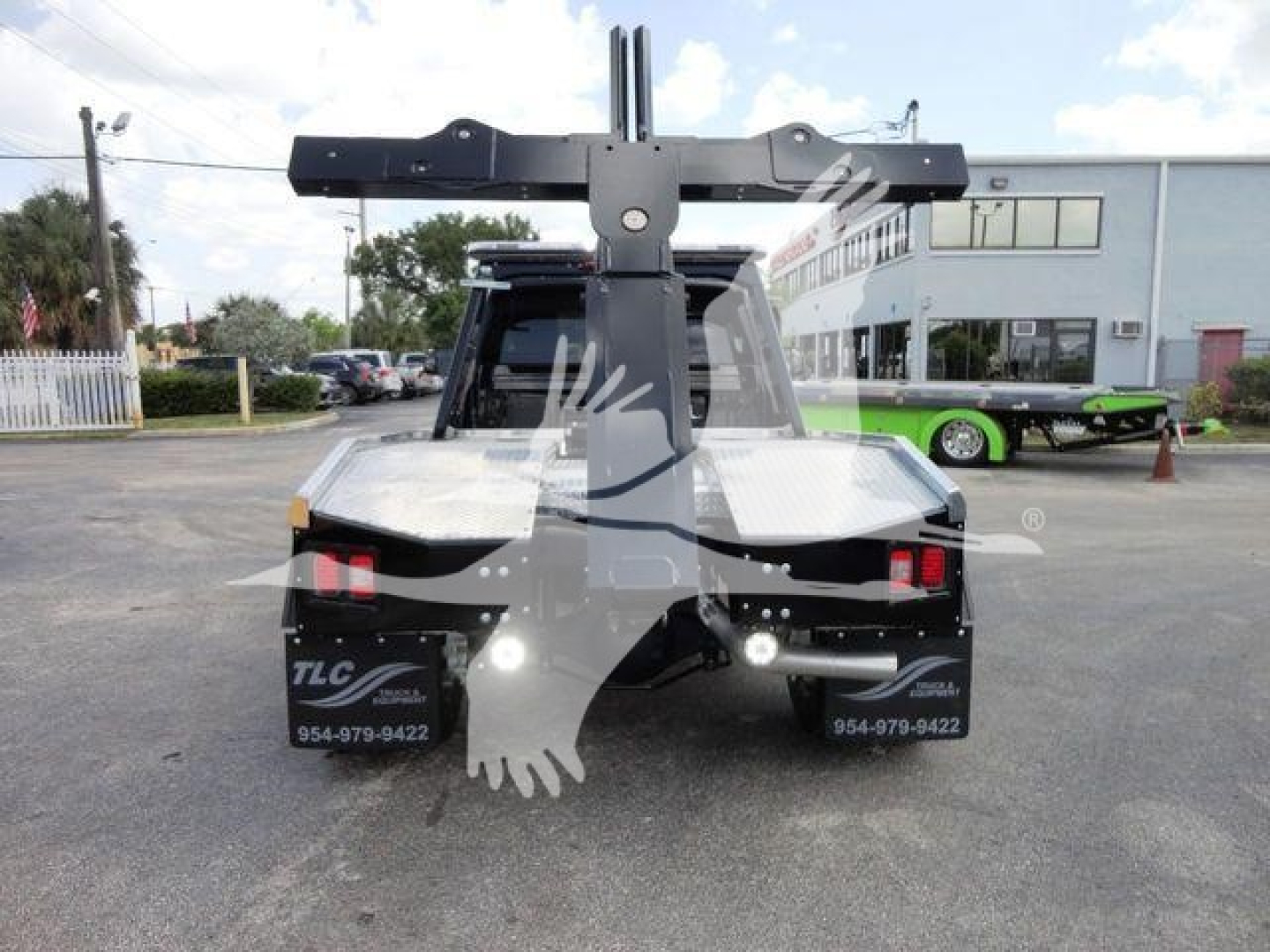 Ram 4500 HD SLT rear view with heavy-duty winch mounting apparatus and hitch, truck bed, taillights, and dealership watermark on the bumper area.